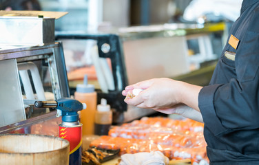 Japanese chef making salmon sushi - japanese food
