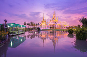 Fototapeta premium Wat Luang Pho Toh temple with water reflection in twilight time,