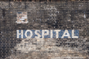 Fototapeta premium Old Painted Hospital Sign