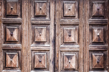 Abstract texture of a brown antique wooden old door in italy eur