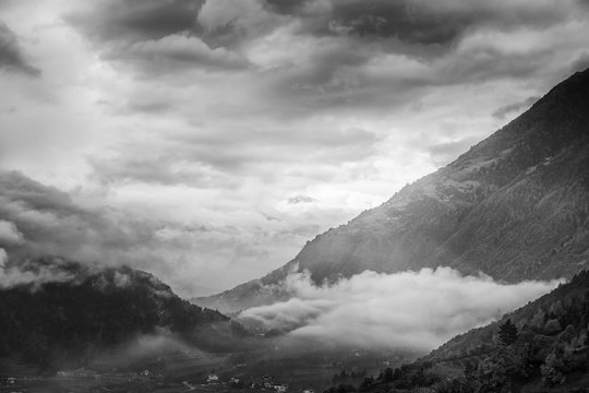 Fototapeta Beautiful sunset in the mountains. Black and white landscape wit