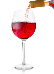 Red wine being poured into glass 