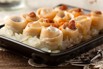 Rolled herring in olive, served with onions. Perfect for vodka.