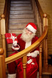 Santa Claus preparing Christmas presents for kids on Christmas