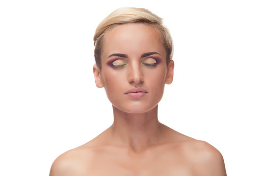 Woman wearing make up with closed eyes