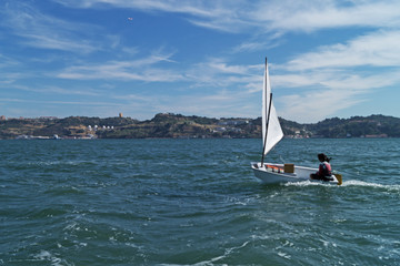 Fototapeta premium Girl with the coach involved in sailing on a sunny day