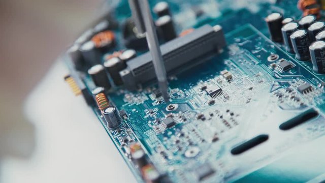 Passive Components PCB micro: resistors and capacitors. Electrical engineering. Working with the chips. Stand for chips. Storage of finished chips. High-tech manufacturing. Circuit board production.