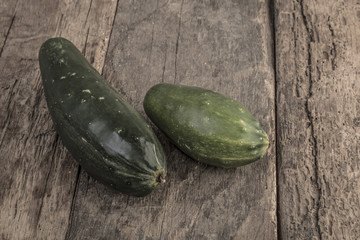 Fresh cucumbers on wooden table