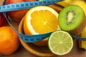 Vegetables and fruits on a wooden table. Diet concept. Healthy food. Raw food diet. Weight loss and...