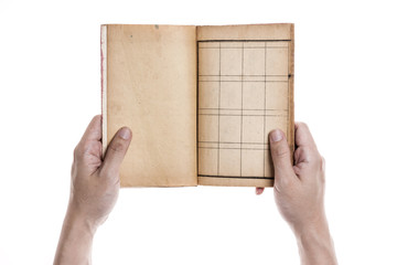 Two hands hold a empty(blank) vintage book spread isolated white.