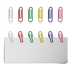 Vector realistic colored paper clips in different positions.