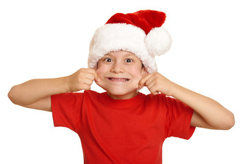 boy child portrait in santa hat, having fun and emotions, winter holiday concept