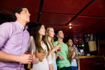 Friends holding beer