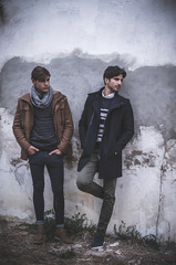 Portrait of two young man posing with fashionable winter clothes