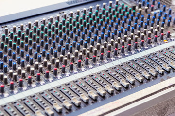 Audio Mixing Console Closeup in selective focus.