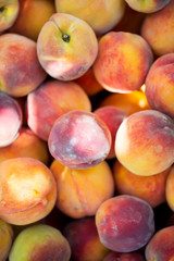 Ripe organic peaches. Top view. Soft focus