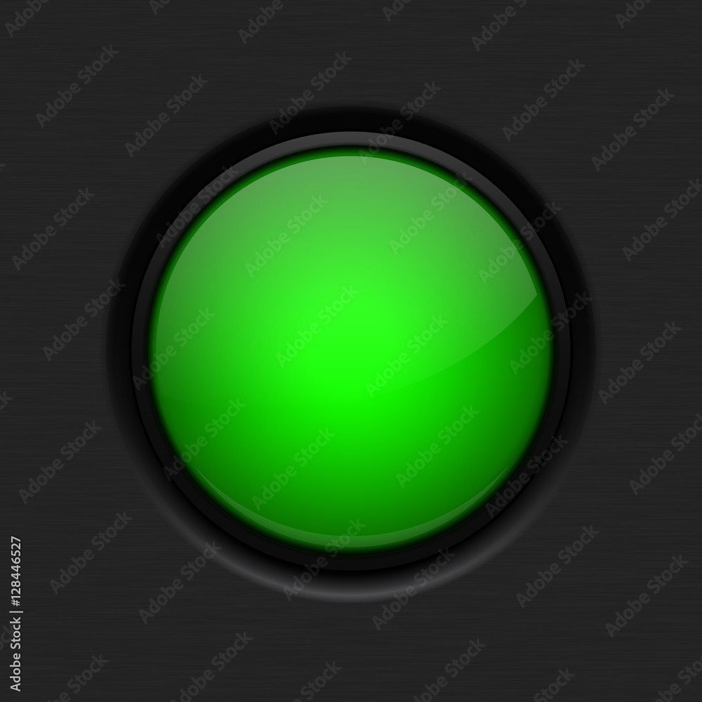 Wall mural green button on dark background