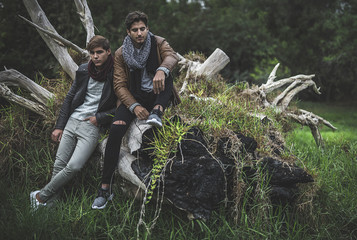 Portrait of two young man posing with fashionable winter clothes