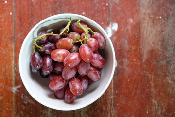 Ripe red grape in white plate