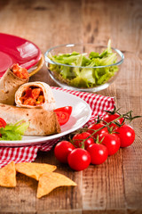 Tortilla wraps with chicken and vegetable. 
