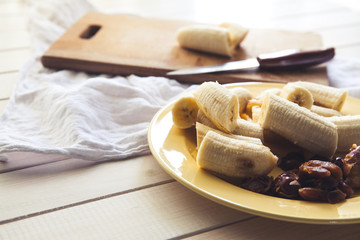 Sliced bananas and figs on a wooden table. Healthy food. Organics. Fruit