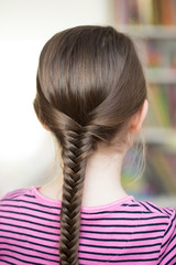 Hairstyle portrait of a little girl. Perfect hairstyle for schoo