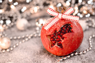 Christmas pomegranate. Selective focus