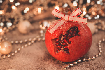 Close-up image of Christmas promegranate with retro filter effec