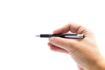 Hand with pen writing on white