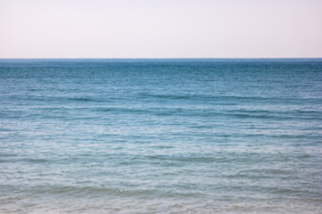 Obraz premium Sea and cloudless sky. Blue water and horizon. Infinity is waiting. Seascape at daytime.