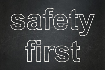Security concept: Safety First on chalkboard background