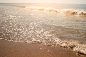 Wave on the shore. Sunshine and sea. Best spot for summer rest. Far from bustle and problems.