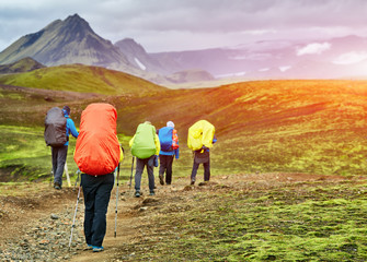 Fototapeta na wymiar hikers with backpacks on the trail in the mountains. Trek in Iceland