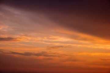 Fototapeta na wymiar Sky during sunrise. Orange sky and thin clouds. Mother nature wakes up. Admire the magic colors.
