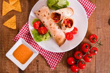Tortilla wraps with chicken and vegetable. 
