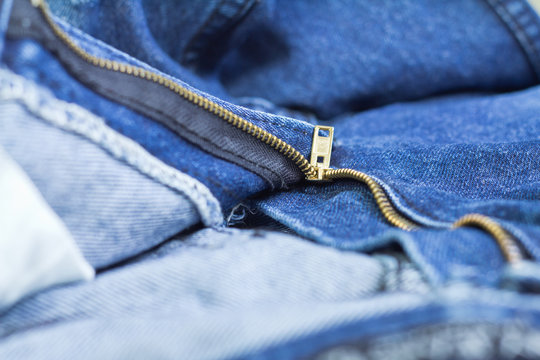 macro of a zip in a jeans