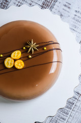 mirror glaze mousse cake with anise and kumquat