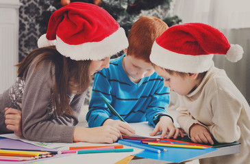 Children writing letter to santa, wait for christmas