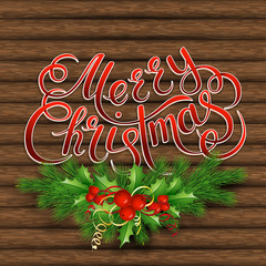 Christmas tree, holly and decorative elements on background of boards