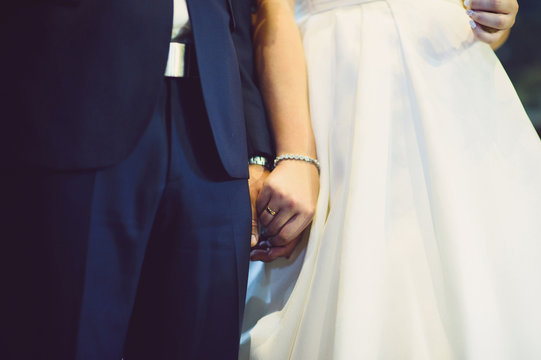 Bride Holding Groom's Hand