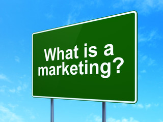 Advertising concept: What is a Marketing? on road sign background