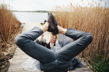 Beautiful stylish couple have fun near the lake