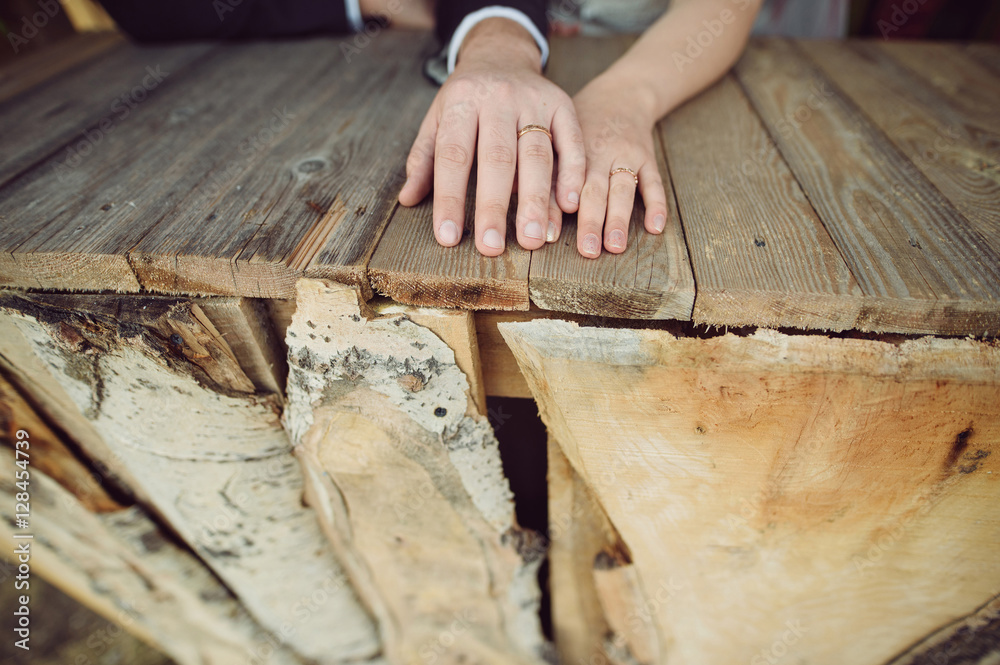 Wall mural newlyweds at wooden table