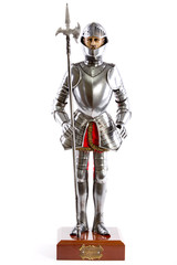 doll of a medieval knight in armor with a lance