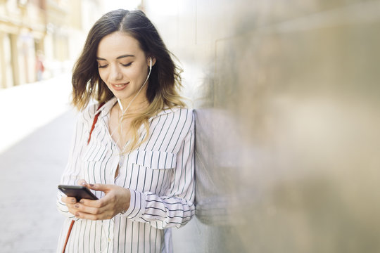 Businesswoman checking the cell phone