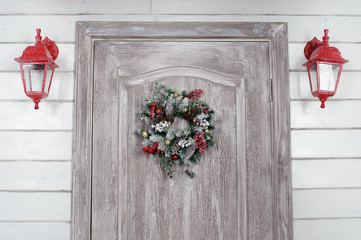 Christmas wreath on door in the interior