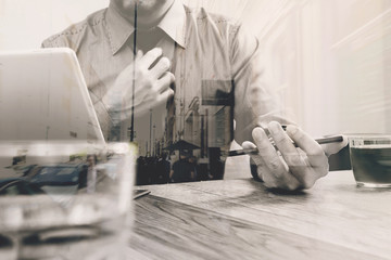 Double exposure of success businessman using stylus pen,digital