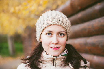young smiling girl in   knitted hat
