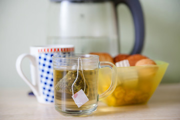 cup of green tea and cookies