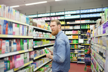  Man near  department with  tools for body care